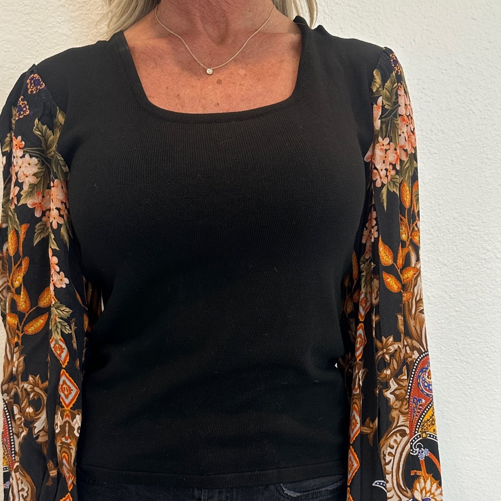 Black Top with Floral Patterned Sleeves